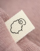 Langermet body i merinoull til baby Pudderrosa