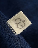 Heldragt i merinouldfrotté til baby Mørkeblå