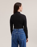 Bluse med lynlås i merinould til kvinder Sort